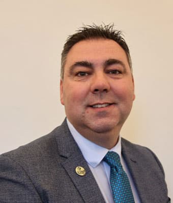 Official portrait of John Paul O'Shea