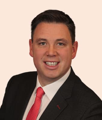 Official portrait of Paul McAuliffe